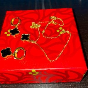 Its 18K Yellow gold with black stone looks like a famous designer brand